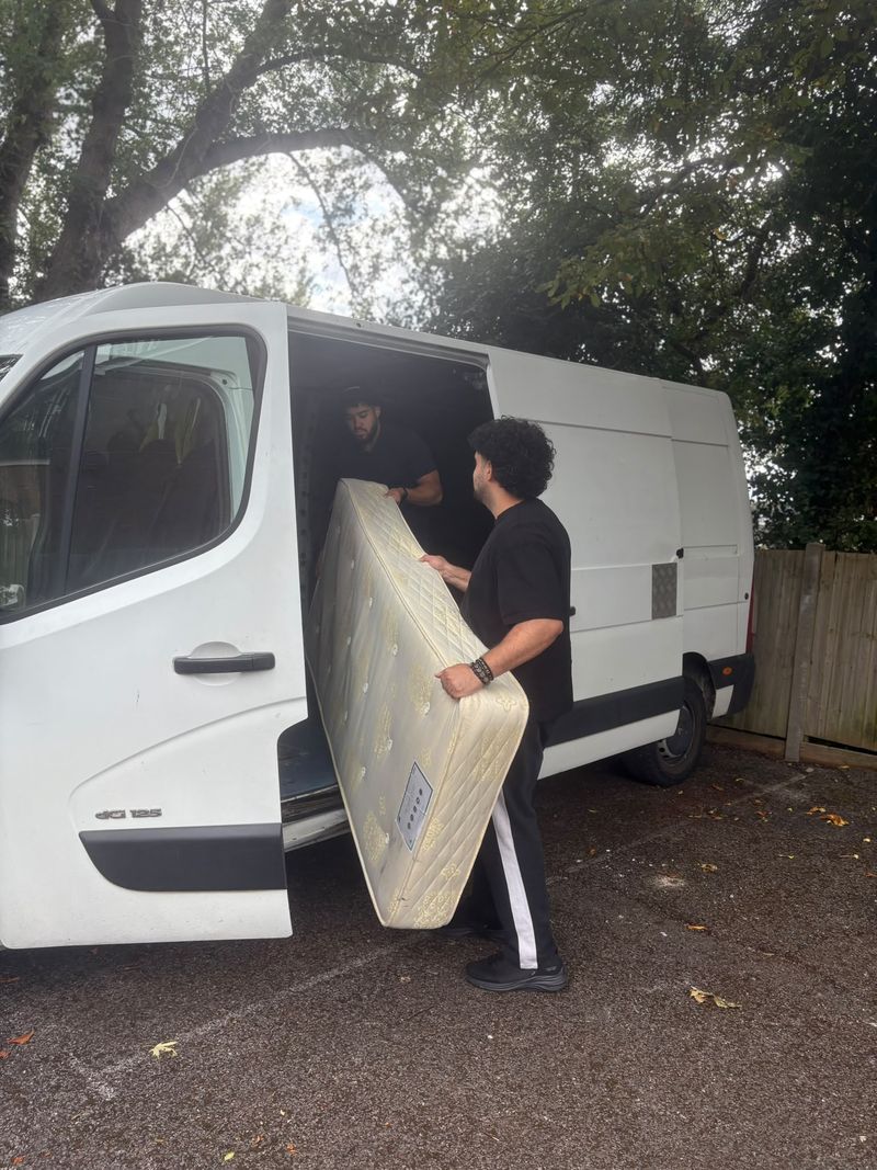 Loading a mattress into the van