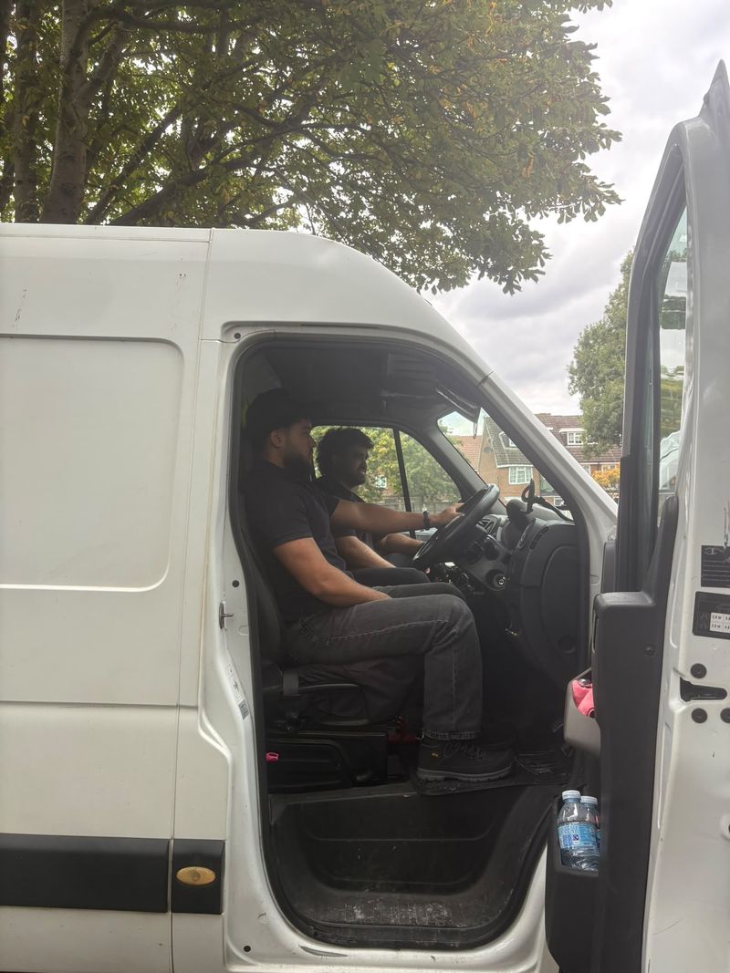 Two of the crew in the van cab